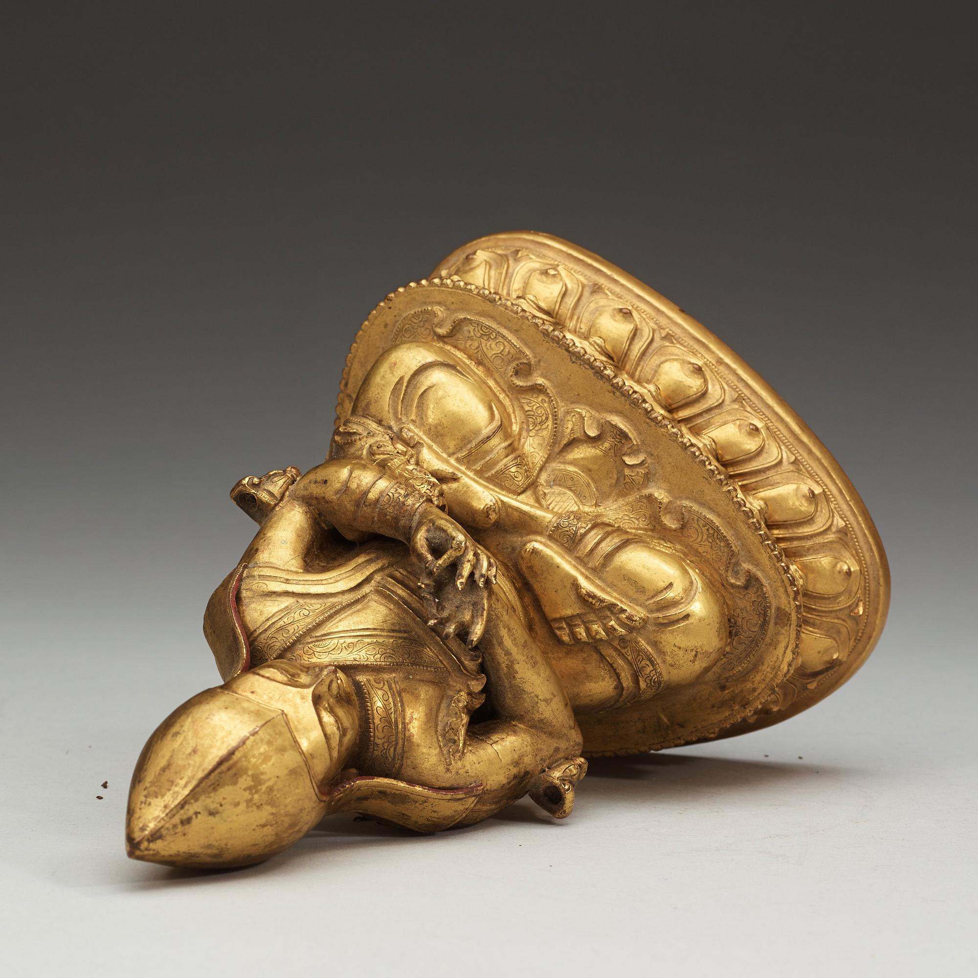 A Sino-Tibetan gilt copper alloy repoussé figure of Tsong Khapa, 18/19th Century.