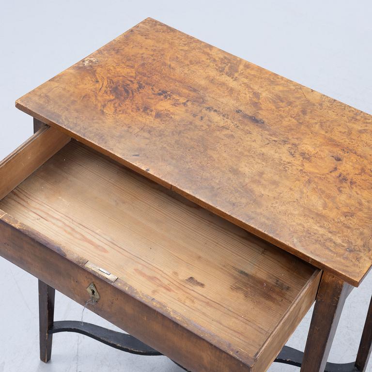 A late Gustavian burr-alder table, circa 1800.