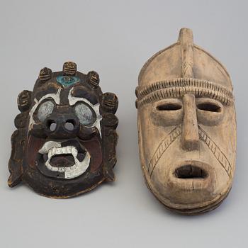 2 asian masks, 20th century.