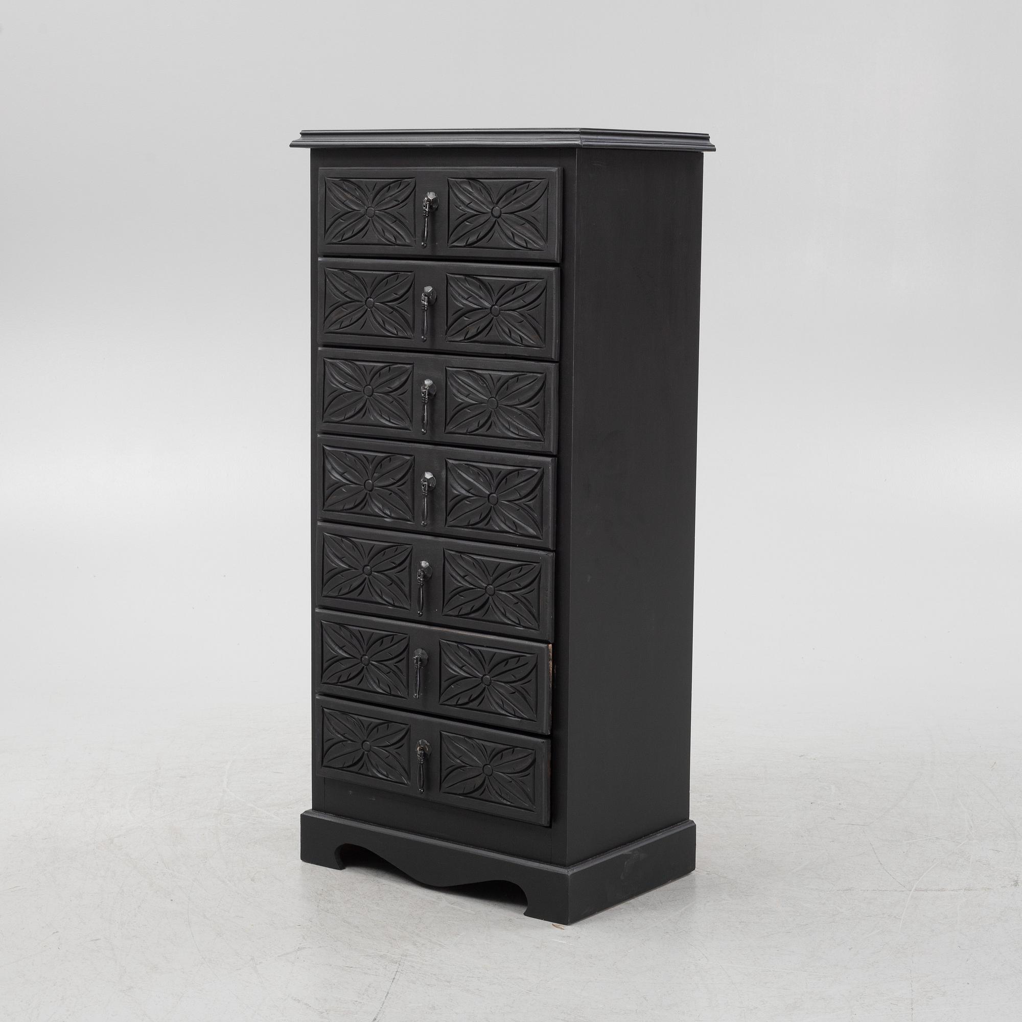 A carved and painted chest of drawers, late 20th Century.