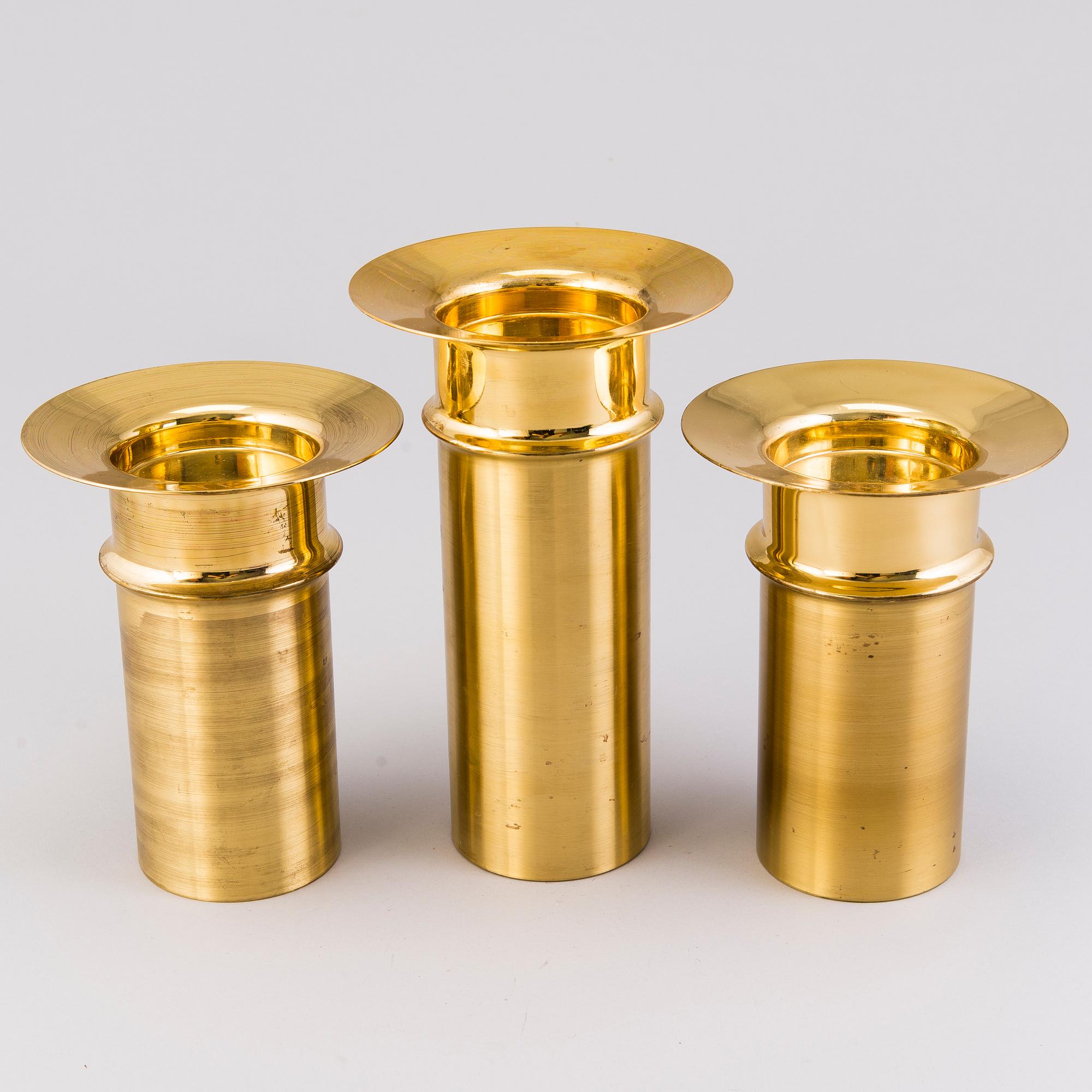 TAPIO WIRKKALA, A set of three brass candleholders, all marked Kultakeskus Oy Made in Finland, Design Tapio Wirkkala.