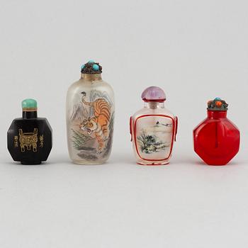 Four Chinese snuff bottles in glass and stone, 20th century.