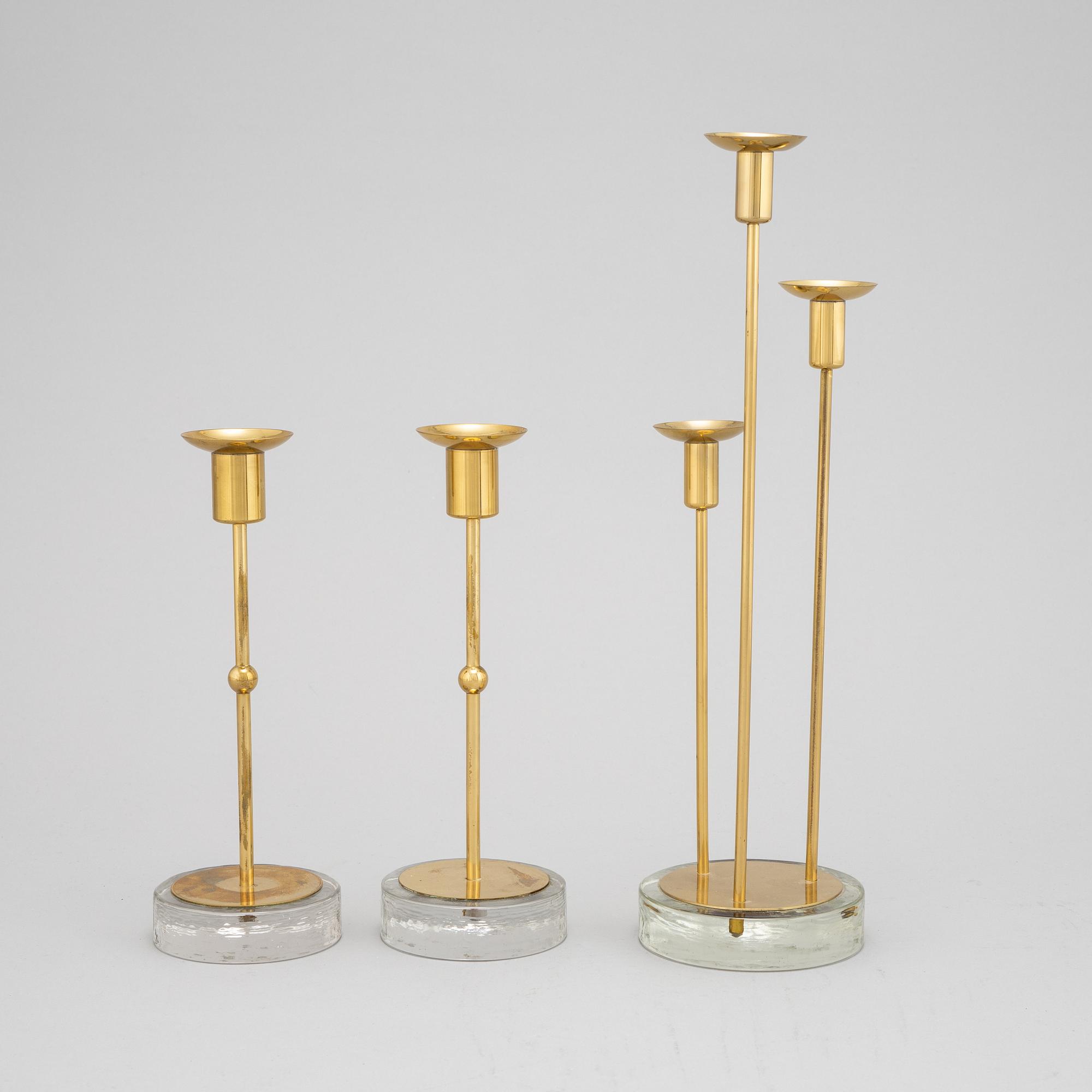 Gunnar Ander, a set of three brass and glass candlesticks from Ystad Metall.