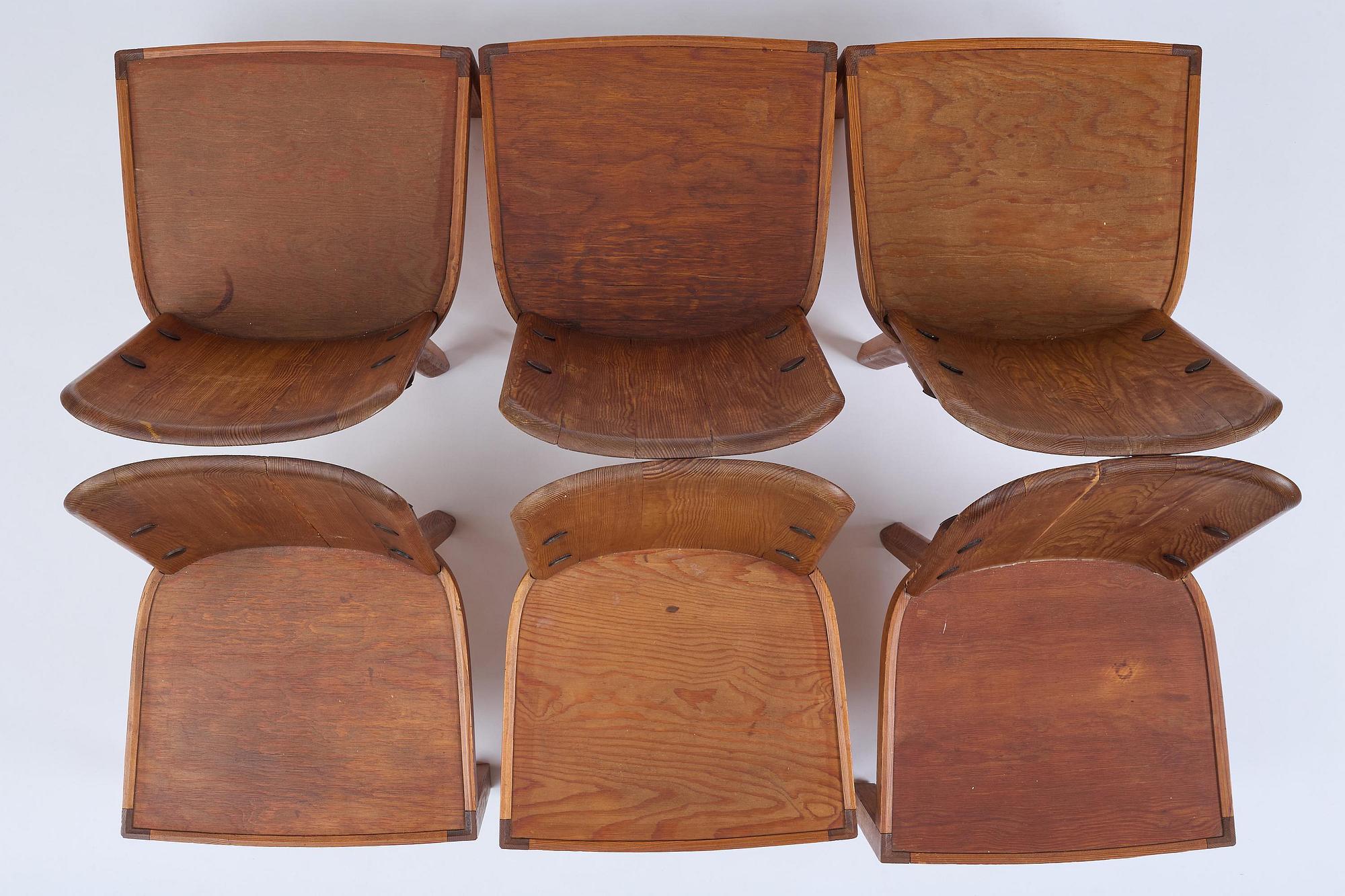Axel Einar Hjorth, a set of six stained pine "Lovö" chairs, Nordiska Kompaniet, Sweden, 1930s.