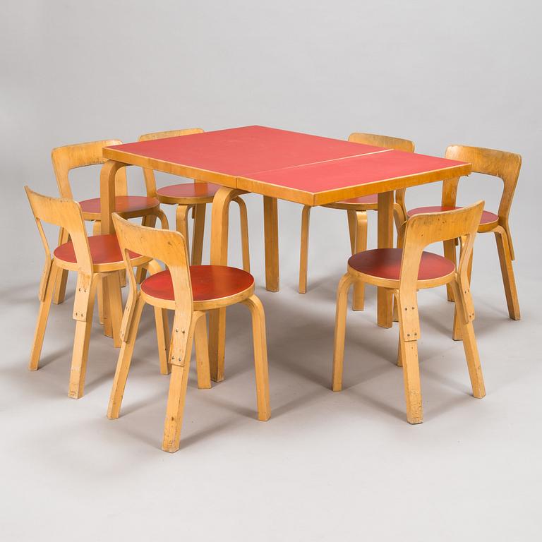 Alvar Aalto, a mid 20th century 'DL85' folding table, seven chairs for Artek.