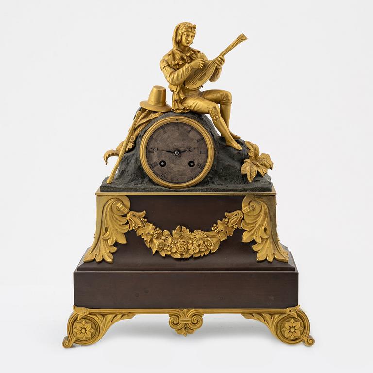 An ormolu and patinated bronze mantel clock, mid 19th Century.