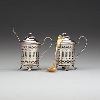 A pair of Swedish 18th century silver mustard-pots and spoons, makers mark of Simson Ryberg, Stockholm 1794.