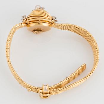 Omega damarmbandsur 18K guld med runda briljantslipade diamanter total vikt ca 0.40 ct.