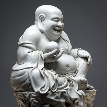 Laughing Buddha Blanc De Chine Porcelain Statue. 20th century.