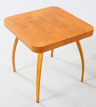 A table and a arm chair from the second quarter of the 20th century.