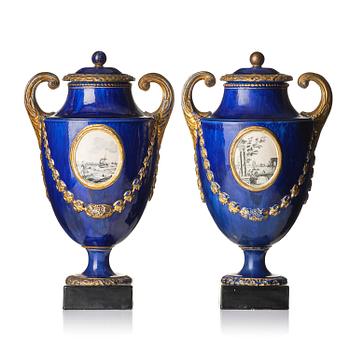 533. A pair of Swedish cream ware 'pistol handle' jars with covers, 1790's.