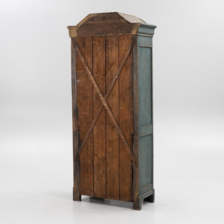 A 19th century vitrine cabinet.