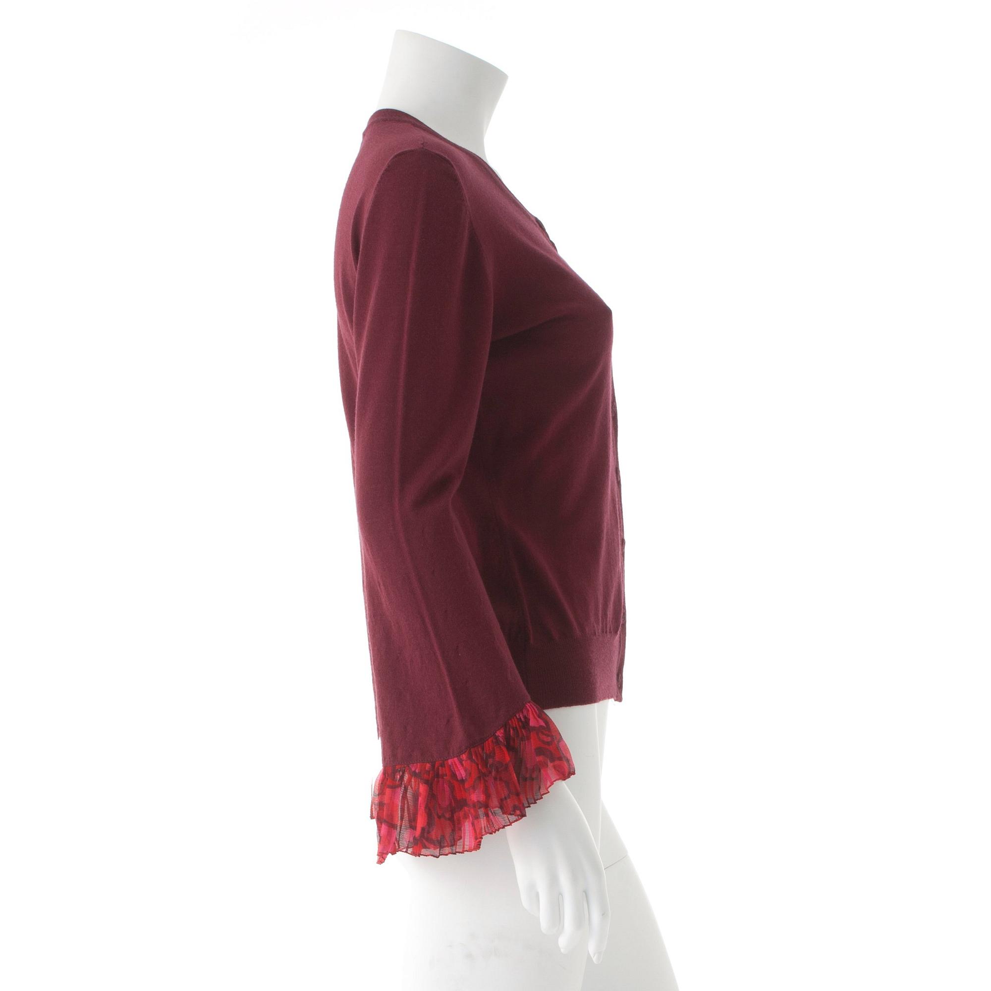 BURBERRY, a burgundy red merino wool cardigan.
