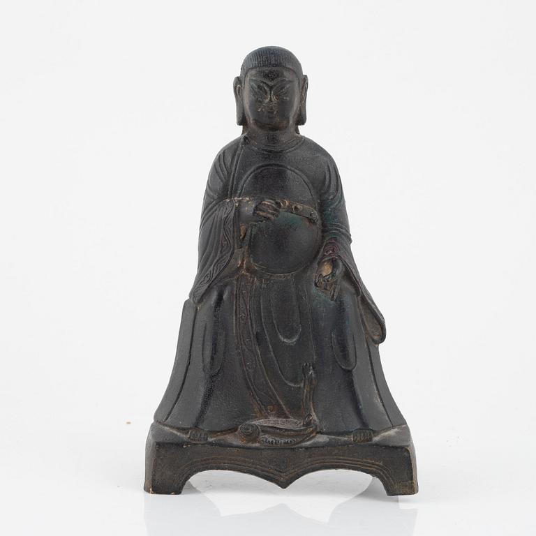A bronze sculpture of a seated deity, Ming style, probably 20th Century.