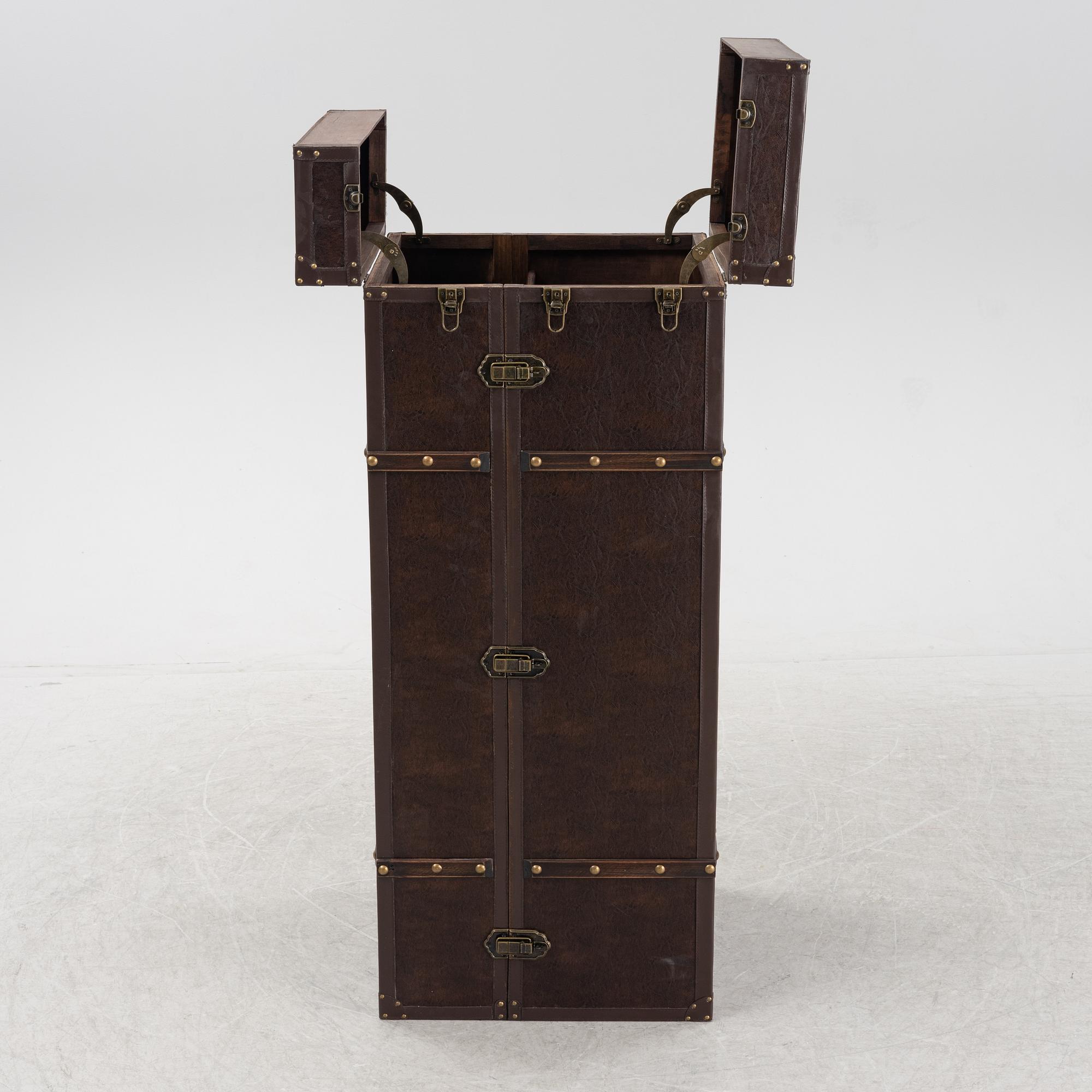 A leather suitcase-shaped bar cabinet.