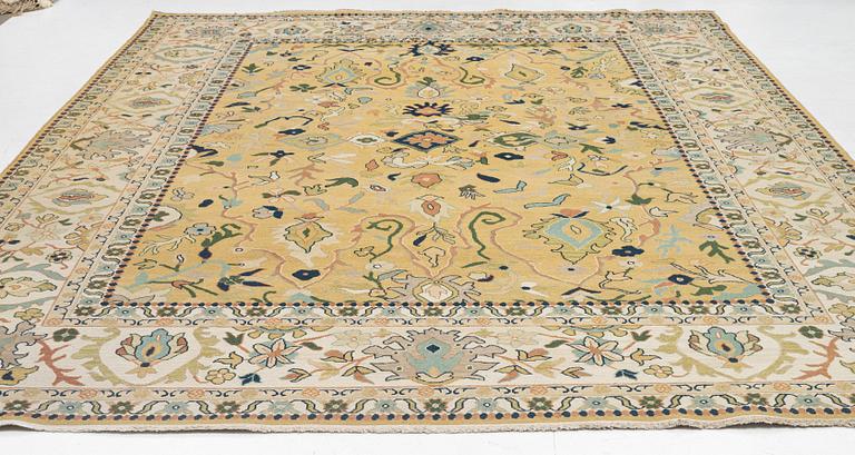 An Indian flat weave carpet of 'Shah Abbas' design, c. 402 x 289 cm.