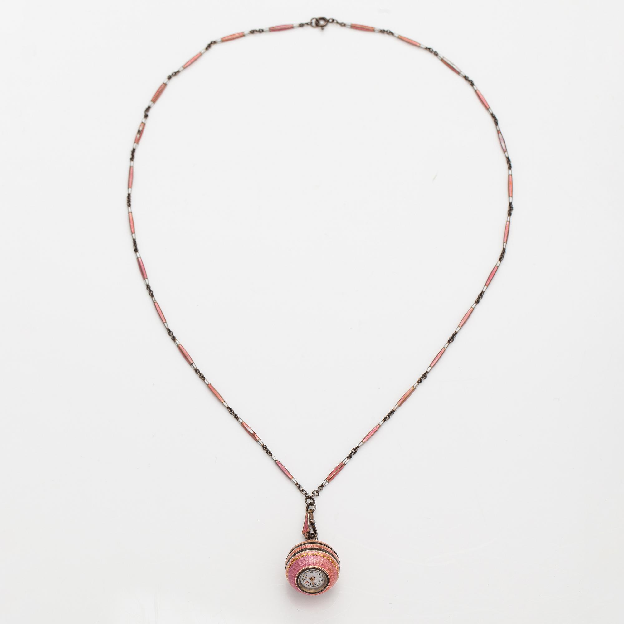 Halsband med klocka, silver och emalj. Tidigt 1900-tal.