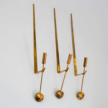PIERRE FORSSELL,  three 'Pendeln' brass wall sconces from Skultuna.
