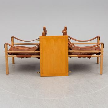 A pair of easy chairs by Arne Norell with a table leaf.