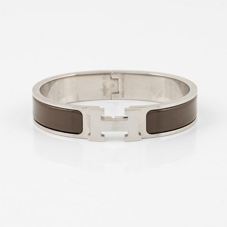 Hermès, a 'Clic H' bracelet.