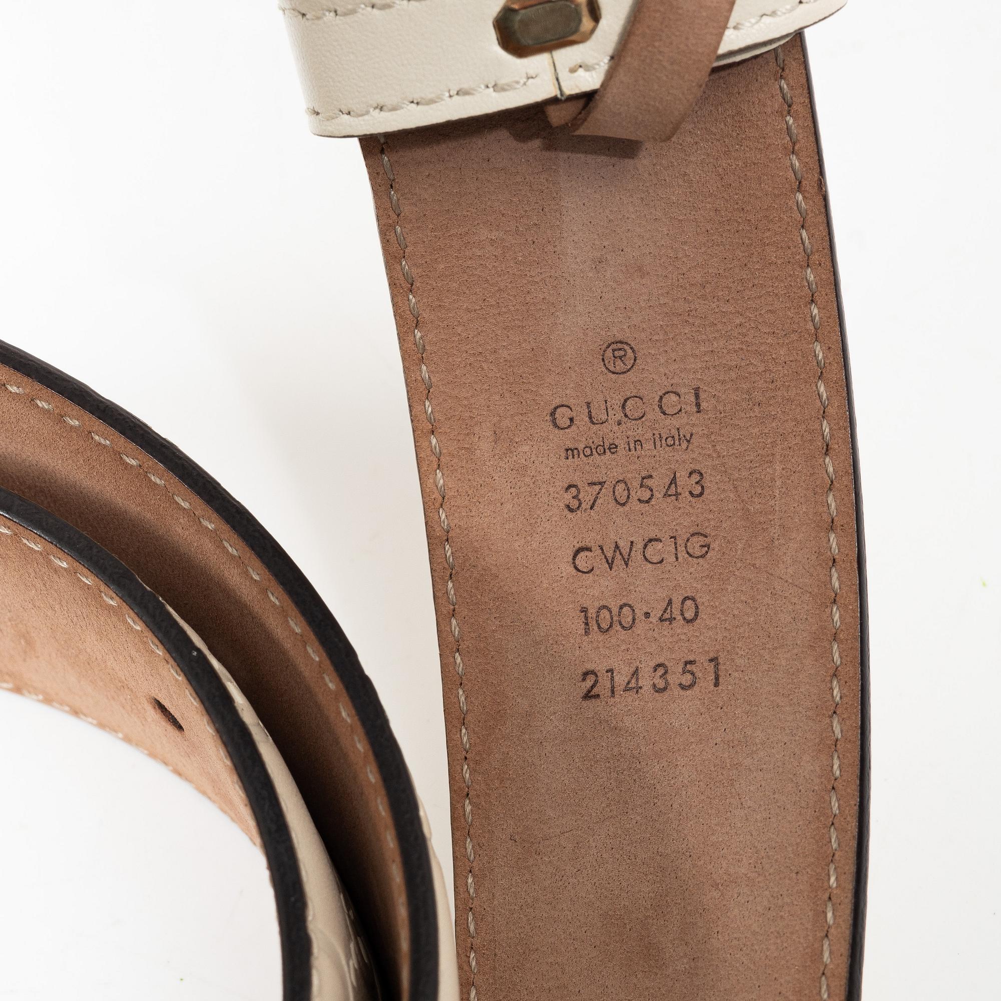 Gucci, wallet and belt.