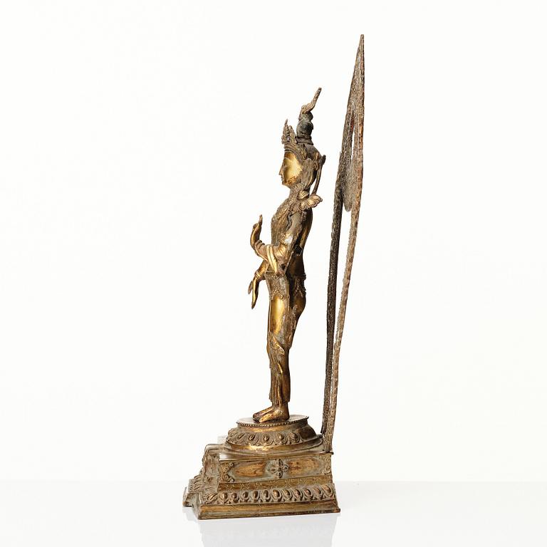 A gilt copper-alloy figure of Boddhisatva Avalokiteshvara, Nepal, 20th century.