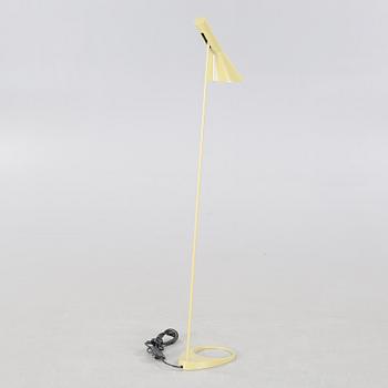 An "AJ" floor lamp, designed by Arne Jacobsen for Louis Poulsen, 21st century.