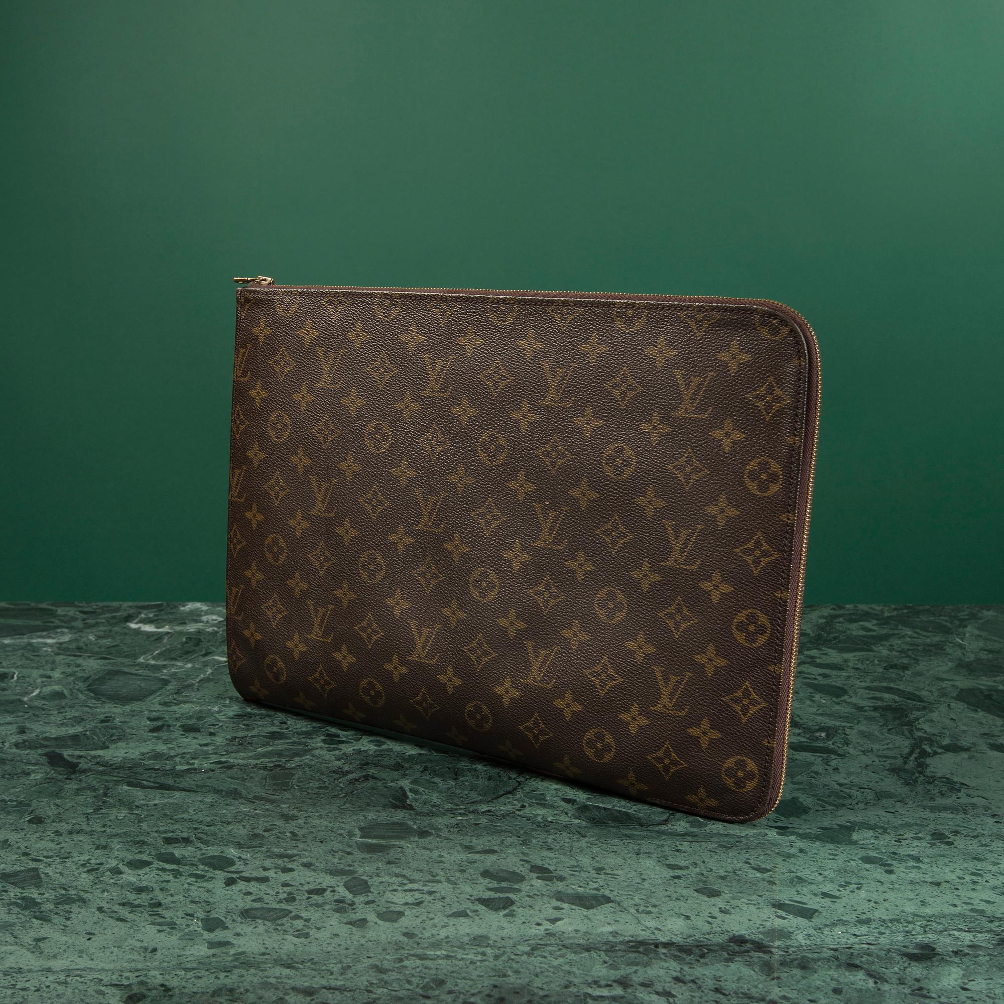 A "Pochette Documents" bag by Louis Vuitton.