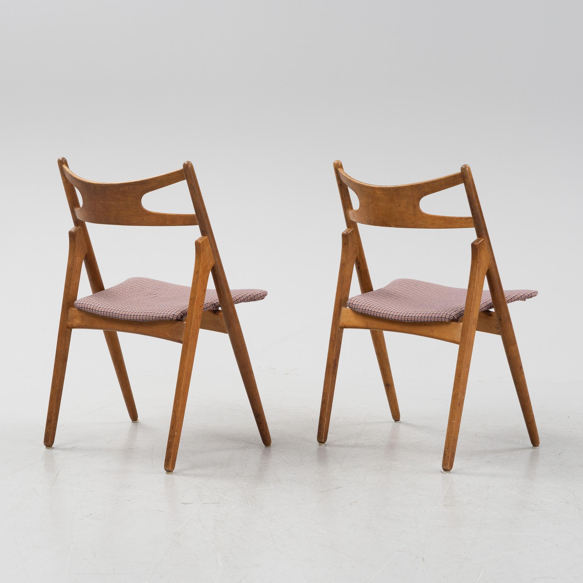 A set of six model CH 29 'Savbukstolen' by Hans J Wegner, designed 1952.