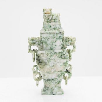 A carved green stone vase with cover, China, 20th Century.