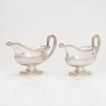 A pair of sterling silver sauce jugs, maker's mark of Andrew Fogelberg, London 1774.