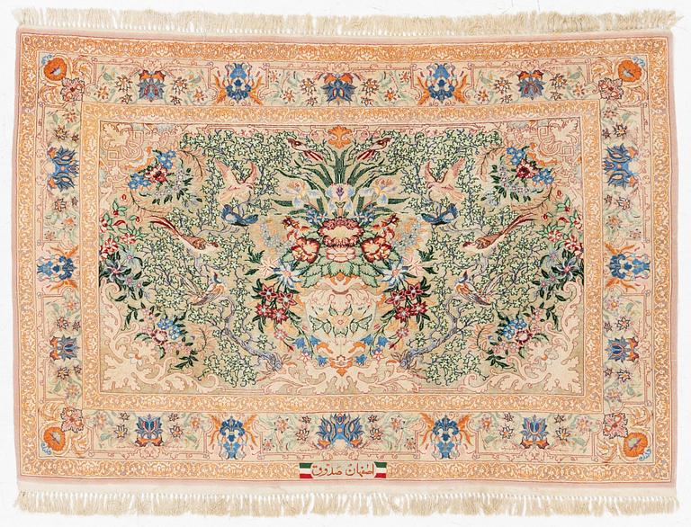 An Esfahan rug, part silk, figural, signed, c. 108 x 155 cm.