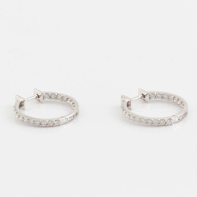 Brilliant cut diamond hoop earrings.