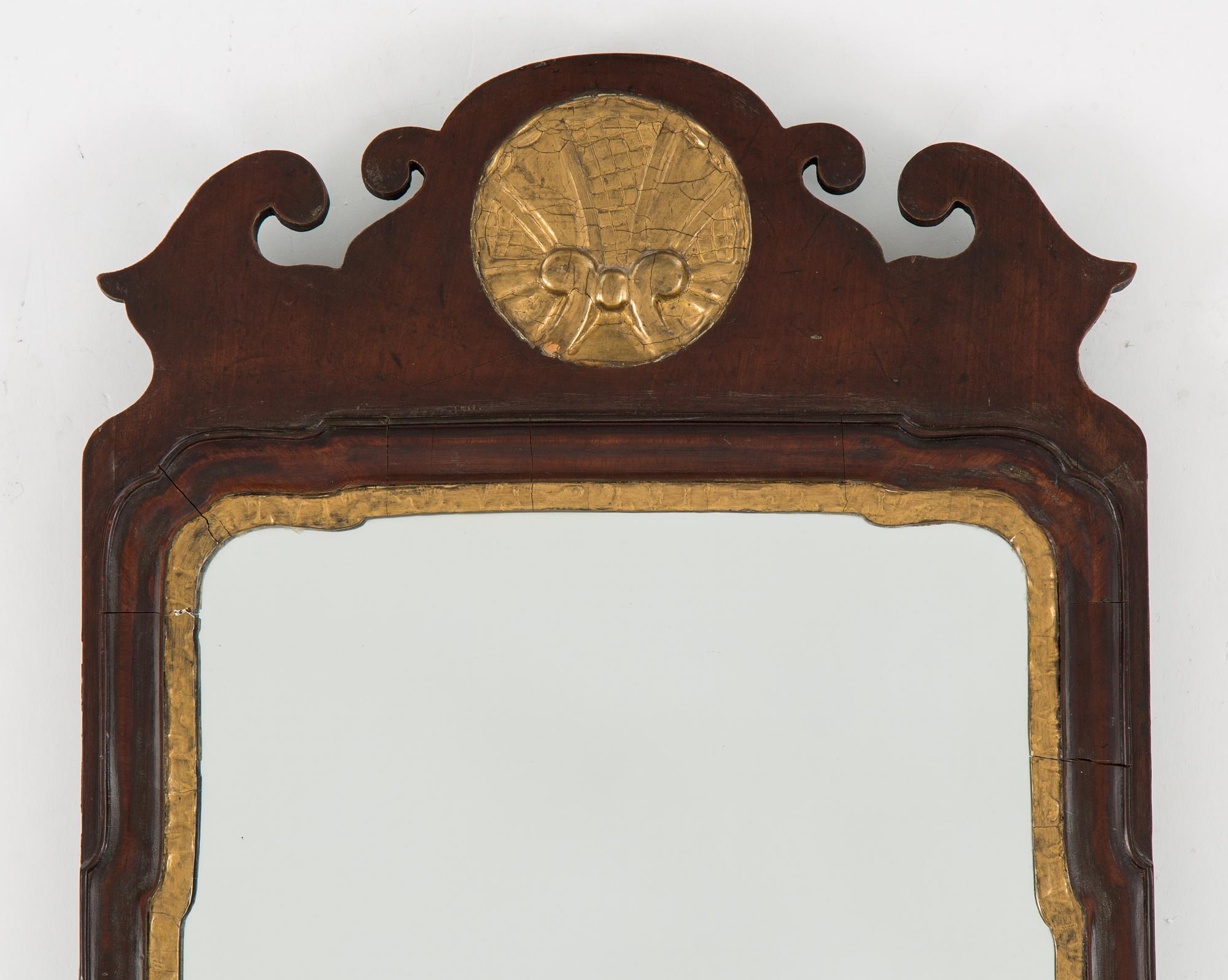 AN ENGLISH 18TH CENTURY MIRROR.