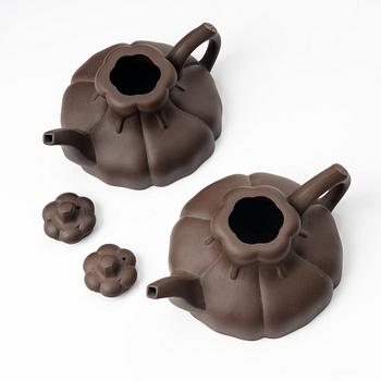 Two similar 'magnolia flower six-petal' yixing teapots, China, 1980s.