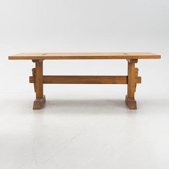An oak trestle table.