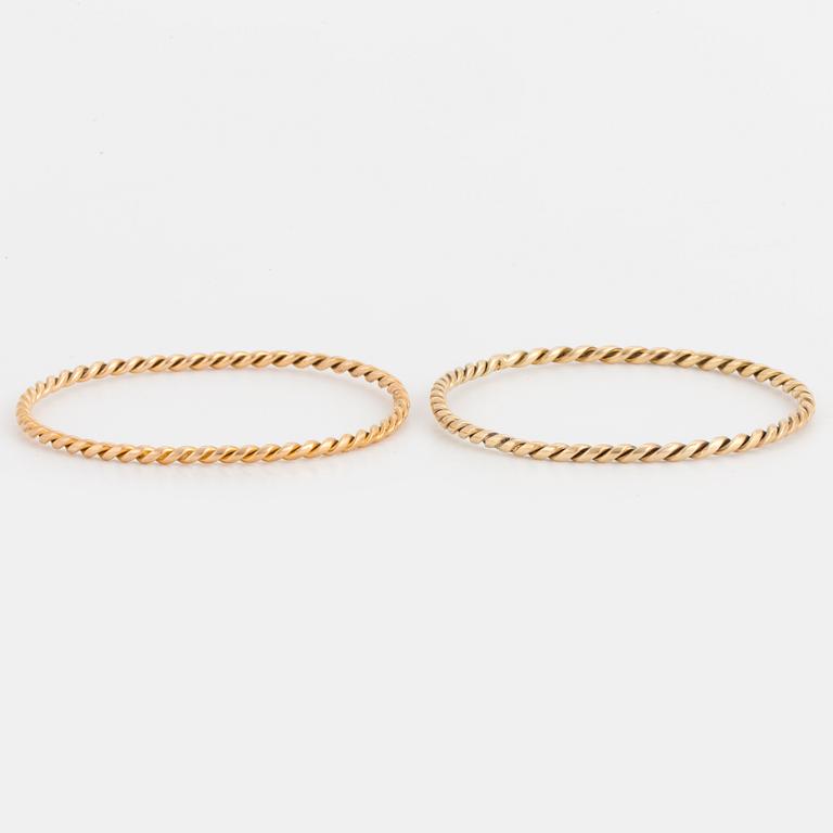 Two 14K gold bangles.