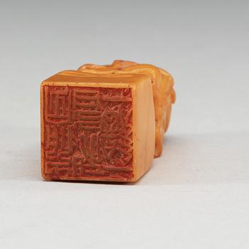 A yellow soapstone seal.