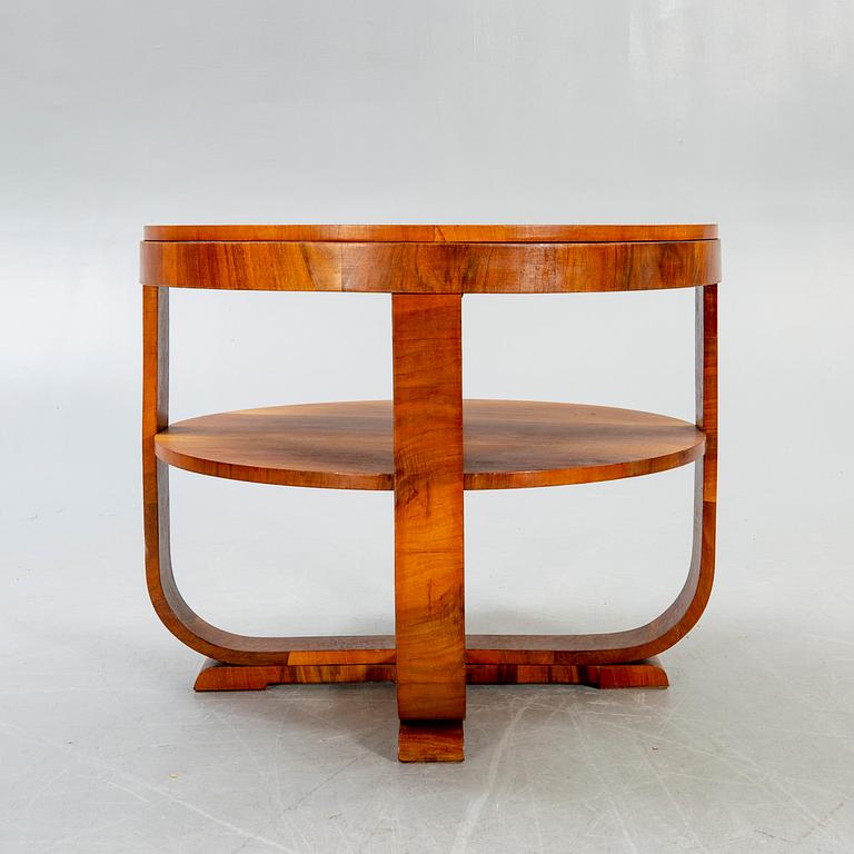 An Art Deco style walnut coffee table later part of the 20th century.