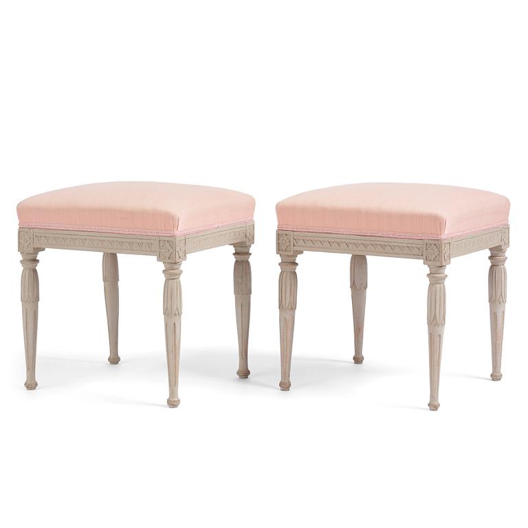 A pair of carved Gustavian stools by E. Öhrmark (master in Stockholm 1777-1813).