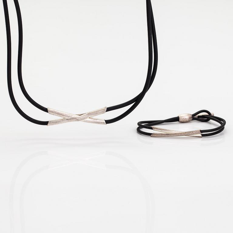 Christoph Burger, A necklace and a bracelet "Edition amour", sterling silver and rubber strap. Lapponia 2003.