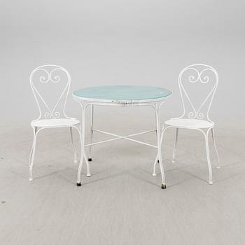 A tabe and two chairs from Byarum later part of the 20th century.