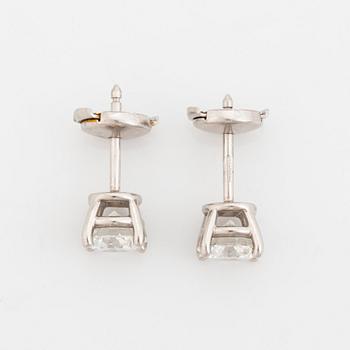 A pair of Tiffany solitaire diamond stud earrings in platinum.