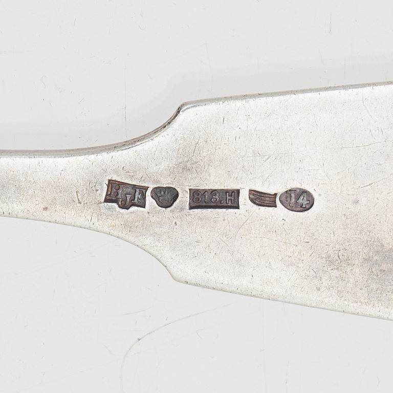 A silver server and six spoons, marks of Grachev, St Petersburg, and Helsingfors Juvel- och Filigranab, respectively.