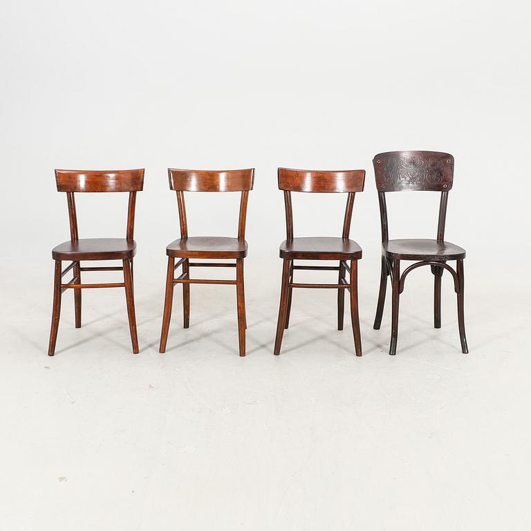 A set of four different early 1900s chairs.