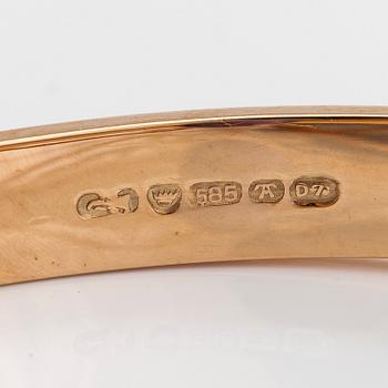 A 14K gold bracelet and amethyst. Auran Kultaseppä, Turku 1957.