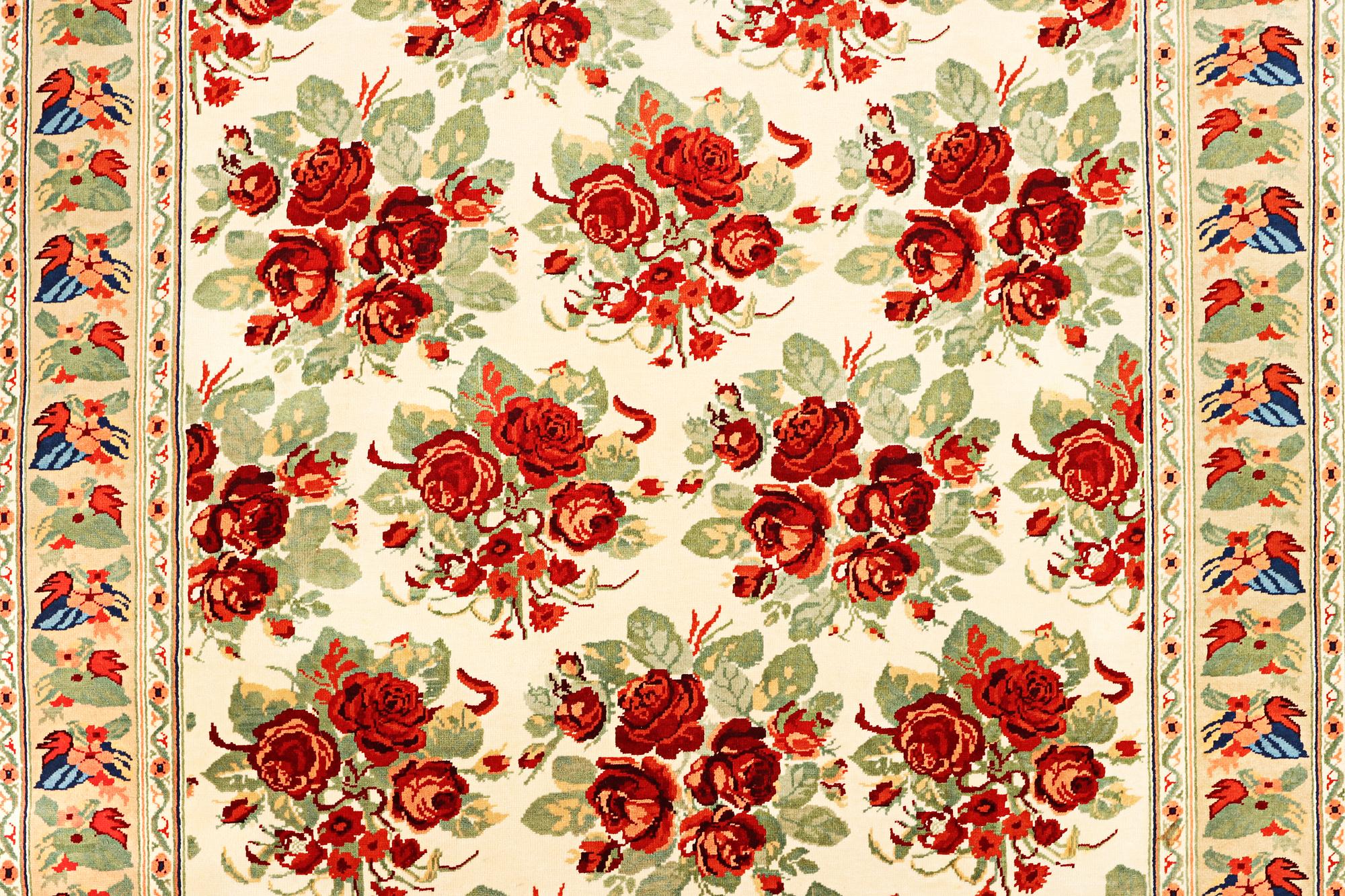 A carpet with a rose pattern, c. 310 x 196 cm.