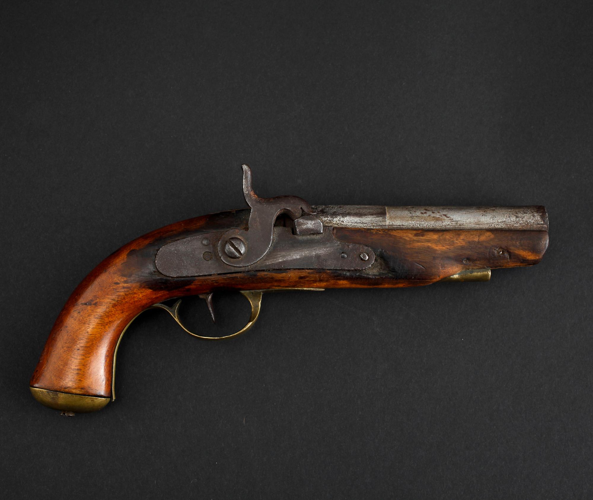 An early 19th century cap lock revolver.