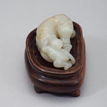 A chinese nephrite figure of a reclining horse and a monkey, early 20th Century.