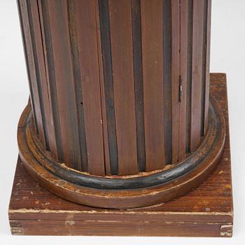 A Swedish Empire column-shaped cabinet, first part 19th century.